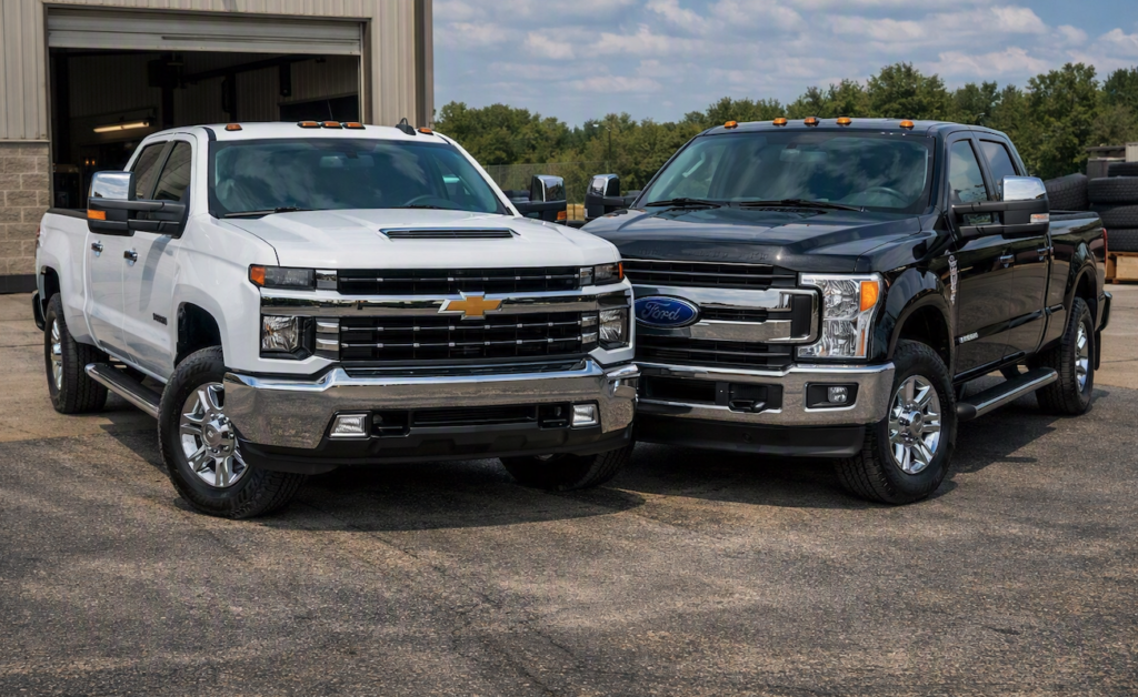 Photo of two HD pickup trucks in a fleet